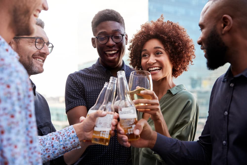 Diverse group of friends enjoying a cold pint at the best Atlanta Breweries